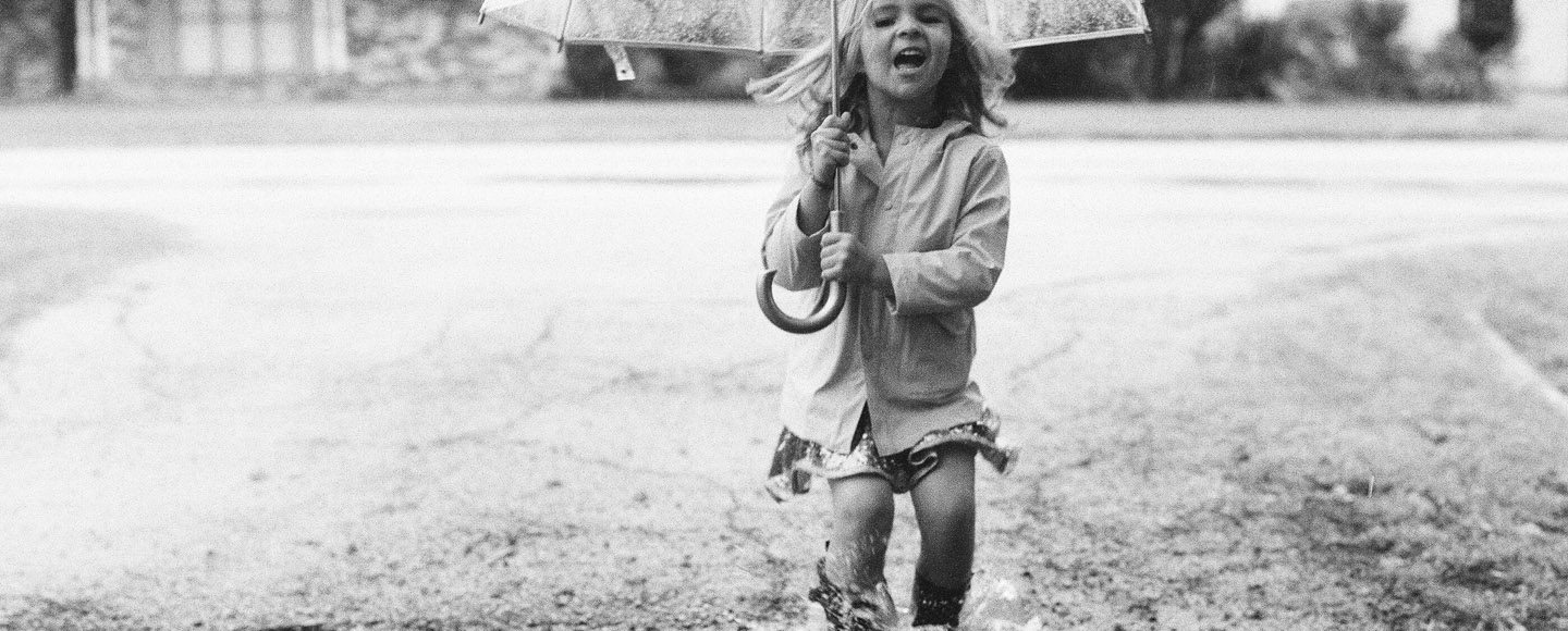 Dallas photographer Jenny McCann captures children playing in rain.